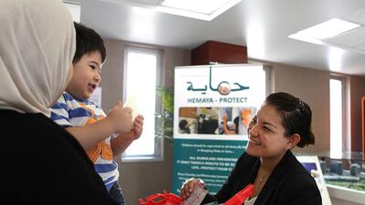 Bunna Eng-Tusitala, burns unit manager at Mafraq Hospital, talks to children about dangers in the home. A study by the hospital found that 90 per cent of burns victims’ parents didn’t know how to treat them. Fatima Al Marzooqi / The National