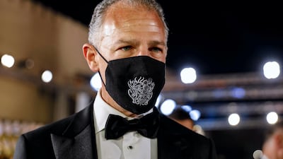 The US ambassador to Egypt, Jonathan Cohen wears a face mask during the opening ceremony of the 42nd Cairo International Film Festival. Reuters