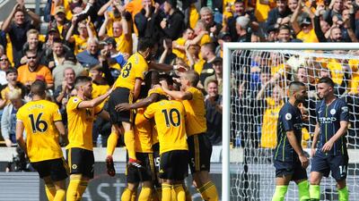 Wolverhampton Wanderers players celebrate after Willy Boly scored the opening goal. AP Photo