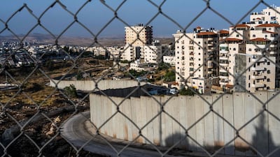A barrier separating the Israeli settlement of Pisgat Zeev (L) from the eastern part of Jerusalem. AFP