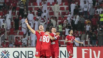 Al Ahli's Kwon Kyung-won, left, celebrates his winning goal against Al Hilal in the Asian Champions League semi-final second leg to reach the ACL final. Jeffrey E Biteng / The National / October 20, 2015