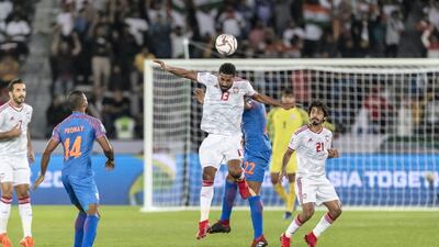 UAE midfielder Khamis Esmail heads the ball.
