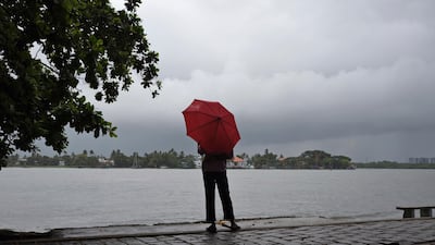 A man stands by the Arabian Sea coast as it drizzles in Kochi in the southern state of Kerala where India's monsoon begins. AP Photo