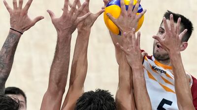 Moritz Reichert of Germany is blocked by players from USA during their Volleyball Men's Nations League match at the Mall of Asia Arena in Manila, Philippines. AP Photo