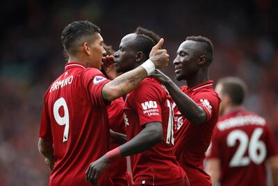 Sadio Mane, centre, and Roberto Firmino make up one of the most feared attacking triumvirates in Europena football alongside Mohamed Salah. Reuters