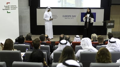 Salem Al Shamsi, left, and Amna Fikri, who are students at the Emirates Diplomatic Academy, speak at an event commemorating the 60th anniversary of the European Union at the school in Abu Dhabi. Christopher Pike / The National / May 9, 2017