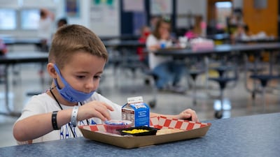Students eat individually due to social distancing on the first day back to school in Louisville, Kentucky, USA. Reuters
