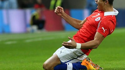Chile's Alexis Sanchez celebrates after scoring a goal during the international friendly soccer match between England and Chile at Wembley Stadium in London. Alastair Grant / AP Photo