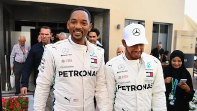 The pair walk in the Paddock before the Abu Dhabi Formula One Grand Prix final race at Yas Marina Circuit. Getty Images