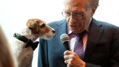 Larry King interviews Uggie, the dog from the film The Artist, before the start of the Friars Club Roast of Betty White in New York on May 16, 2012. Reuters