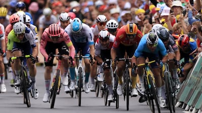 Danish rider Mads Pedersen of Lidl-Trek crashes as British rider Mark Cavendish, front right, fights to cross the finish line and win Stage 5. EPA