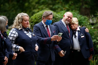 American Airlines flight crew pay their respects at the September 11 Memorial Garden at Grosvenor Square in London, England. (Photo by Hollie Adams / Getty Images)