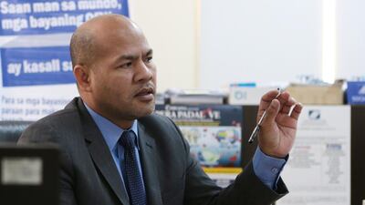 Danilo Calape of the Philippines social-security scheme in his Abu Dhabi office. Christopher Pike / The National