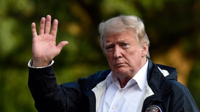 President Donald Trump waves as he walks across the south lawn of the White House in Washington on September 19, 2018. AP Photo