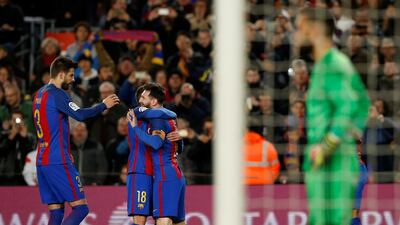 Barcelona’s Lionel Messi, Jordi Alba and Gerard Pique celebrate a goal. Albert Gea / Reuters