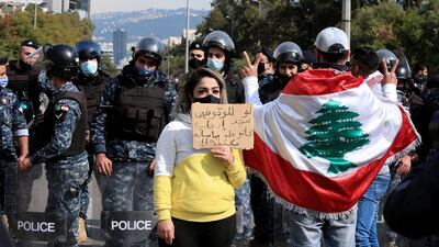 Families and relatives of those arrested and anti-government protesters from Tripoli, Beqaa and Beirut protest in front of the military court in Beirut, Lebanon, February 22, 2021. EPA