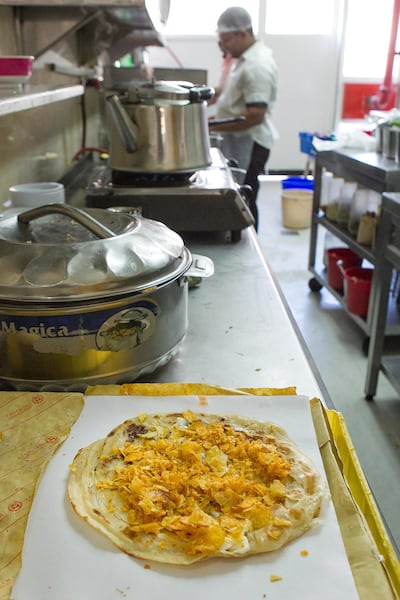 In addition to karak chai, rounding staples include a chips Oman sandwich. Just remember not to get out of your car. Mona Al Marzooqi for The National