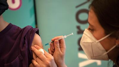 A health worker prepares a dose of the Pfizer-BioNTech Covid-19 vaccine at a vaccination centre in Santiago, Chile. AFP