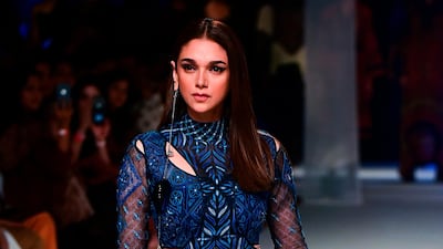 Aditi Rao Hydari presents a creation by designer Ritu Kumar during Lakme Fashion Week in Mumbai. AFP