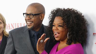 Actors Oprah Winfrey and Forest Whittaker, cast members of the film "Lee Daniels' The Butler", pose at the film's premiere in Los Angeles August 12, 2013. REUTERS/Fred Prouser (UNITED STATES - Tags: ENTERTAINMENT) *** Local Caption *** LAB07_USA-_0813_11.JPG