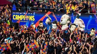 Barcelona players and fans celebrate after winning the Spanish Primera Liga title. But dark days may be ahead for Barca.
