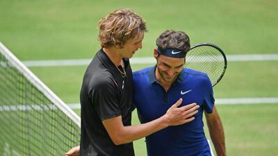 HALLE, GERMANY - JUNE 18: Alexander Zverev (L) of Germany hugs Roger Federer of Switzerland after winning his half final match during day six of the Gerry Weber Open at Gerry Weber Stadium on June 18, 2016 in Halle, Germany. (Photo by Thomas Starke/Bongarts/Getty Images)