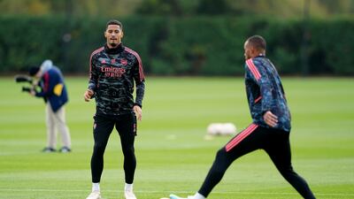 Arsenal's William Saliba, left, and Gabriel during training. PA