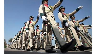 Newly graduated police officers take part in a parade at the Dubai Police Academy yesterday.