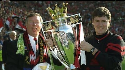 8 May 1994: Manchester United Manager Alex Ferguson (left) and Assistant Manager Brian Kidd hold the Premiership trophy after the match against Coventry City at Old Trafford in Manchester, England. The match ended in a 0-0 draw. Mandatory Credit: ShaunBotterill/Allsport
