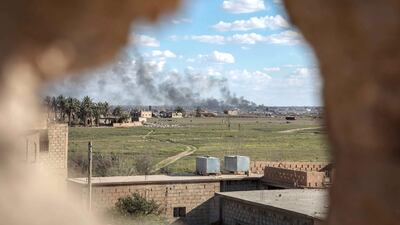 ISIS-held Baghouz, in Syria's Deir Ezzour province, viewed from an SDF frontline position. Campbell MacDiarmid