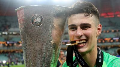 Chelsea's Kepa Arrizabalaga celebrates winning the Europa League with the trophy. REUTERS