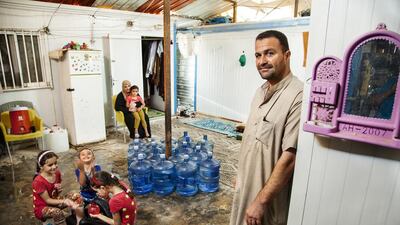 Abdulrahman Mohammad Abu Noqta, a former lorry driver, stands outside his family’s home in Za’atari refugee camp. Near the family are 19 large plastic containers bearing a cumulative total of 380 litres of water, the amount the family uses daily. They purchased a water tank, now installed outside their home, that pipes water into their bathroom and kitchen. Camp authorities refill the tank every five days. “We’re very economical with our water because we don’t have enough,” said Ms. Abu Noqta. “We’re afraid that, some day, we will not have water because, sometimes, the water trucks go on strike.” Courtesy Unicef