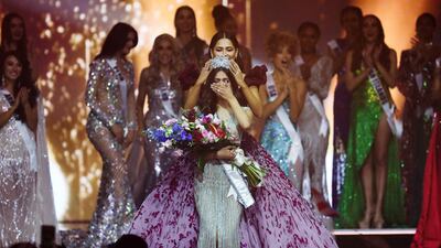Outgoing Miss Universe Andrea Meza of Mexico places a crown on the head of Miss Universe winner Harnaaz Sandhu of India. Reuters
