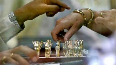 A tourist checks out a bracelet at the Gold Souq in Dubai.