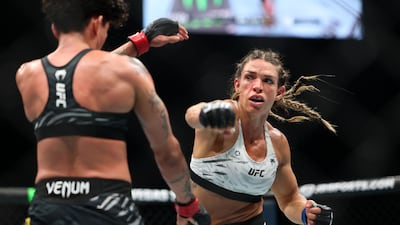Mackenzie Dern, right, took a unanimous decision over Virna Jandiroba to win UFC gold in Abu Dhabi. Chris Whiteoak / The National
