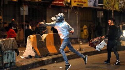 Palestinians throw stones during clashes with Israeli security forces in the wake of a protest against US President Donald J. Trump's Middle East peace plan to solve the conflict between Palestinians and Israel, near the West Bank City of Hebron. EPA