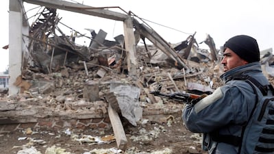 An Afghan soldier stands guard at the site of an attack a day after a car bomb blast, which targeted a British security contractor group G4S, in Kabul. EPA