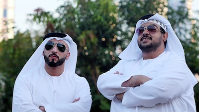 Emiratis Ahmed Al Aqeeli, left, and Adel Galadari sell vintage sunglasses, including the brand famously worn by Sheikh Zayed. Satish Kumar / The National
