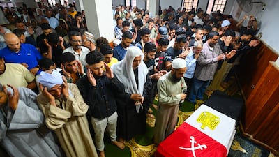 Egyptians perform prayers during the funeral of a soldier killed near the Rafah crossing on Monday. Getty Images