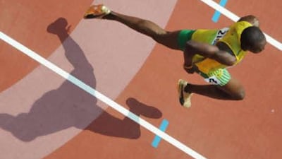 Jamaica's Usain Bolt competes for the men's first round 200m race heat 5 at the Bird's Nest National Stadium