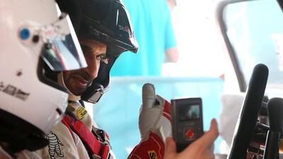 The National’s Jonathan Raymond, left, chats with Emirati rally car driver Sheikh Khalid Al Qassimi before they hit the Yas Marina Circuit on Thursday. Fatima Al Marzooqi / The National