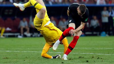 Goalkeeper Jordan Pickford of England and Ante Rebic of Croatia clash. EPA