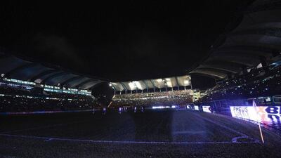 The stadium descends into darkness after the floodlights failed, causing a blackout during the second half. Juan Barreto / AFP