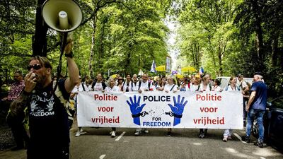 Protesters take part in a march for 'human connection,' organized by the Police For Freedom Netherlands movement, in Apeldoorn. EPA