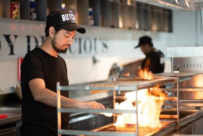 The open kitchen allows you to watch your Angus beef patty being fired up on the grill. Courtesy The Butcher.