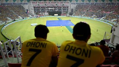 MS Dhoni fans at the Ekana Cricket Stadium in Lucknow. AFP