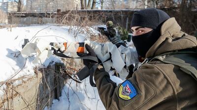 Citizens take part in a military exercise for civilians conducted by members of the Georgian National Legion paramilitary volunteer unit amid the threat of the Russian invasion in Kyiv, Ukraine. Reuters