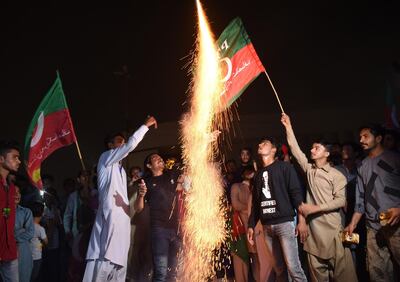 Supporters of Imran Khan celebrating his win. Rizwan Tabassum / AFP