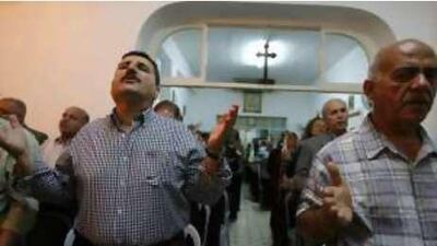 Iraqi Christians attend a mass prayer at the Assyrian church in Amman, Jordan, on Oct 19 2008.