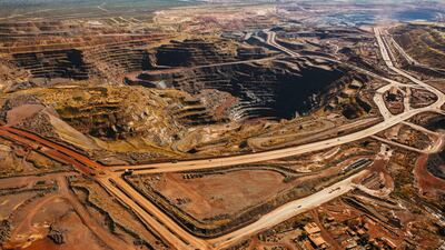 The iron ore excavation pit stands at the Sishen open cast mine, operated by Kumba Iron Ore Ltd., an iron ore-producing unit of Anglo American Plc, in Sishen, South Africa, on Tuesday, May 22, 2018. Kumba Iron Ore may diversify into other minerals such as manganese and coal as Africa’s top miner of the raw material seeks opportunities for growth and to shield its business from price swings. Photographer: Waldo Swiegers/Bloomberg